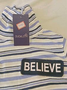 Striped Turtleneck with BELIEVE Patch