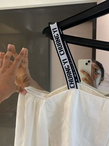 Chic White Button-Up Blouse with Logo Straps