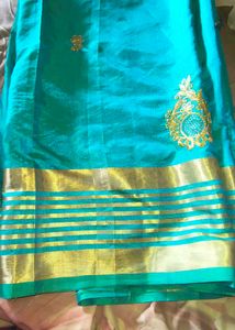 Stunning Teal Saree with Gold Border