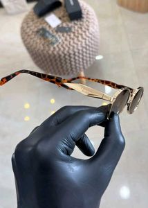 Prada Oval Sunglasses Gold Brown