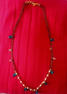 Elegant Black Bead Necklace with Blue Accents