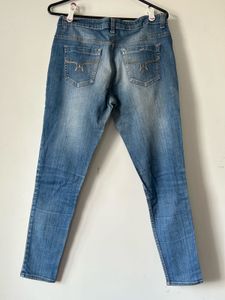 Women's Blue Distressed Jeans with Patch