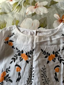 Embroidered White Peplum Top
