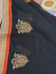 Elegant Orange Saree with Black Border