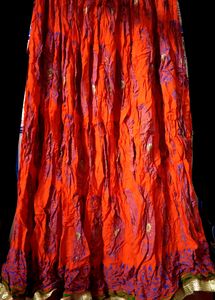 Ethnic skirt, deep Orange colour with blue print.