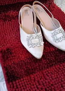 17. Elegant White Slingback Heels
