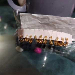 Set of 5 pair golden stone stdded huggie hoops.