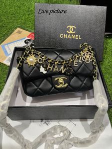 Chanel Quilted Charm Sling Bag