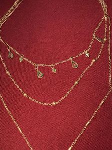 Gold Tone Layered Necklace with Green Leaf Pendant