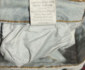 Light Wash Ripped Jeans with Side Stripe