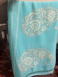 Elegant Teal Saree with Intricate Design