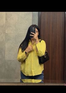 beige yellow shirt and heels