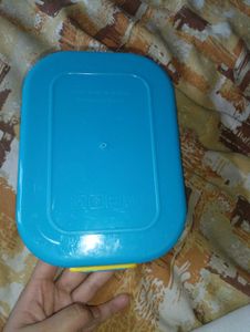 a lunch box in blue and white colour