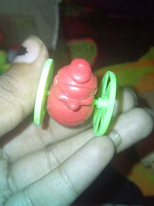 Vintage Toy Character with Wheels