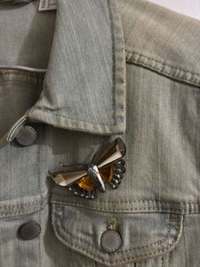 Light Wash Denim Jacket with Butterfly Brooch