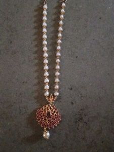 Elegant Pearl Necklace with Red Stones