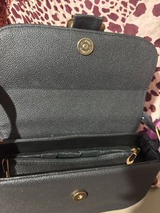 Chic Black Crossbody Bag with Gold Buckle