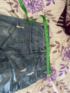 Distressed Blue Denim Jeans