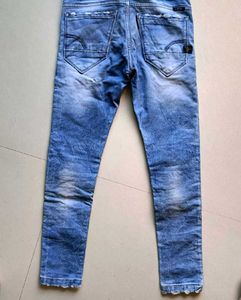 Distressed Blue Denim Jeans