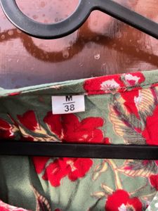 red and green floral top