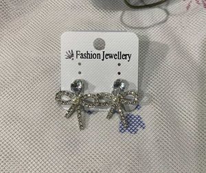 Dangling Bow Stone Earrings