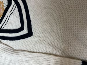 Cream V-Neck Sweater with Black Stripes