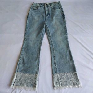 Light Wash Flared Jeans with Lace Trim