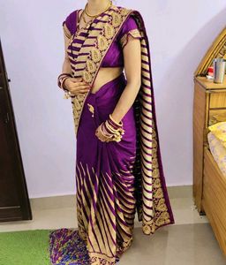 Elegant Purple Saree with Gold Stripes