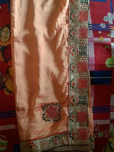 Elegant Peach Saree with Intricate Embroidery
