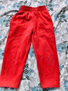 Two pants. Red Jogger Pant and blue jeans Capri fo