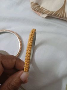 Elegant Gold Bangle with Black Stones