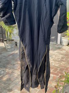 Elegant Black Blouse with Gold Trim