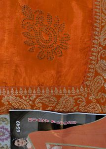 Stunning Orange Saree with Gold Border