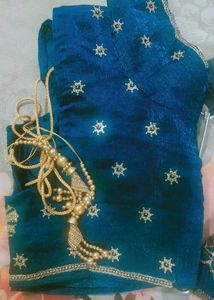 Elegant Teal Saree with Gold Embellishments
