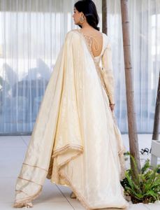 White Anarkali suit with golden embriodery
