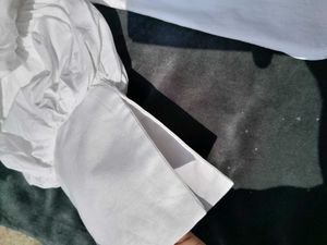 White balloon-sleeve shirt.