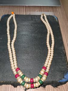 Red, green and white pearl necklace