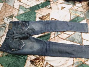 Distressed Blue Denim Jeans