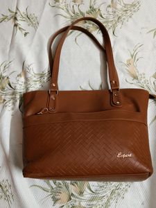 "Carry your essentials in style with this Handbag"
