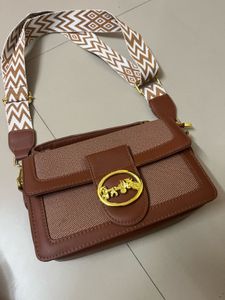 Chic Brown Crossbody Bag with Patterned Strap