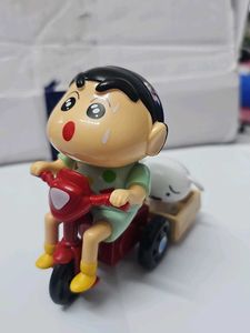 Shinchan on toy bike with shiro