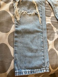 Distressed Light Wash Denim Jeans