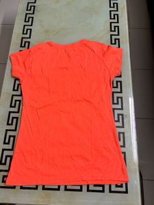Bright coral/orange color casual t-shirt with styl