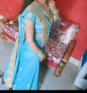 Elegant Teal Saree with Gold Border
