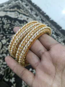 Elegant Gold and Pearl Bangles