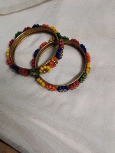 Vibrant Beaded Bangles with Flower Embellishments
