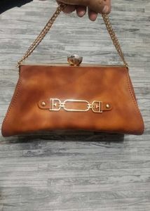 Elegant Brown Clutch with Chain Detail