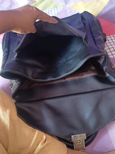 black handbag cum backpack style bag.