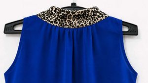 Stylish Blue Sleeveless Top with Scarf Detail