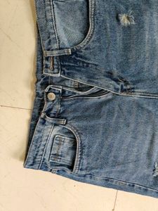 Distressed Blue Denim Jeans